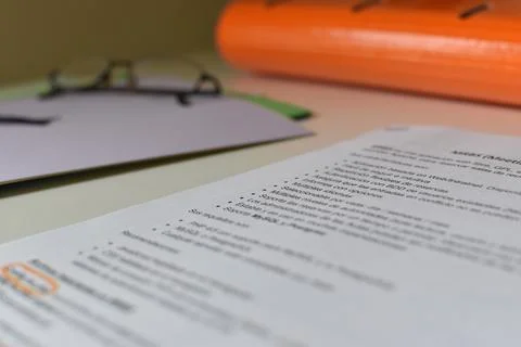 Study table with notes and glasses Stock Photos