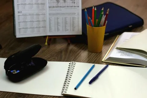 Study table with textbooks and pencils Stock Photos
