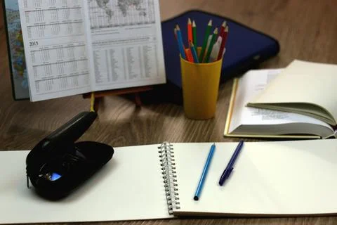 Study table with textbooks and pencils Stock Photos