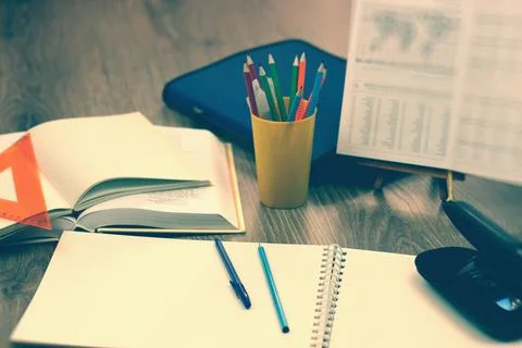Study table with textbooks and pencils Stock Photos
