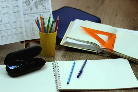 Study table with textbooks and pencils Stock Photos
