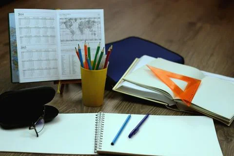 Study table with textbooks and pencils Stock Photos