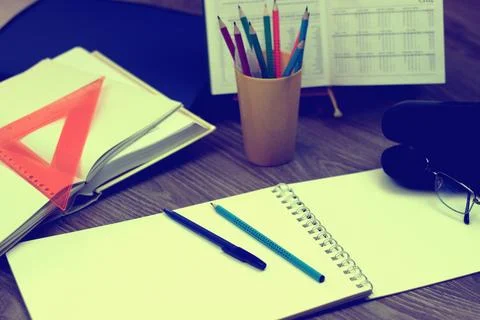 Study table with textbooks and pencils Stock Photos