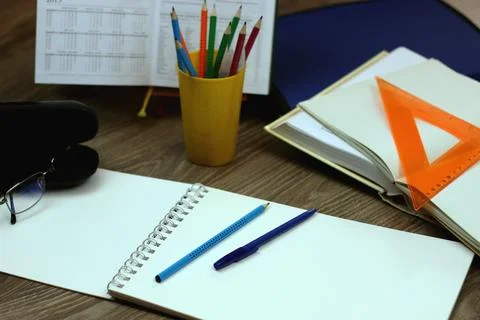 Study table with textbooks and pencils Stock Photos