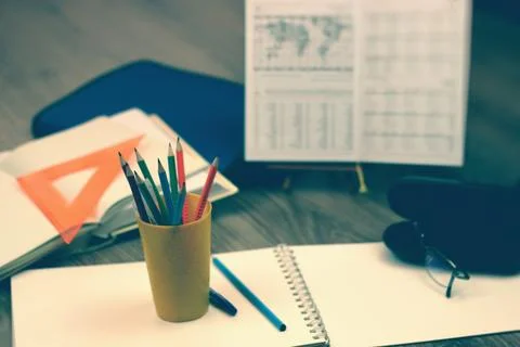 Study table with textbooks and pencils Stock Photos