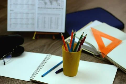 Study table with textbooks and pencils Stock Photos