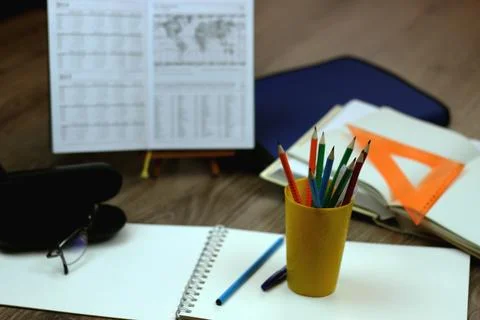 Study table with textbooks and pencils Stock Photos