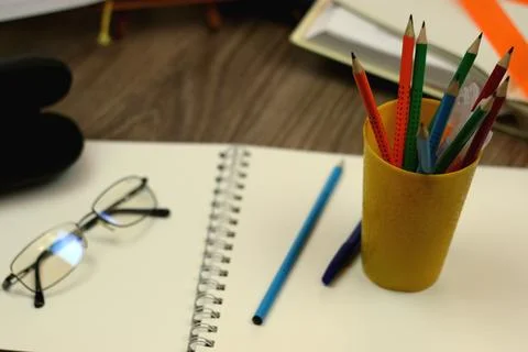 Study table with textbooks and pencils Stock Photos
