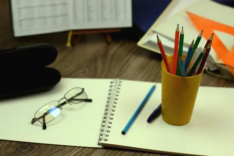 Study table with textbooks and pencils Stock Photos
