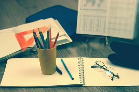 Study table with textbooks and pencils Stock Photos