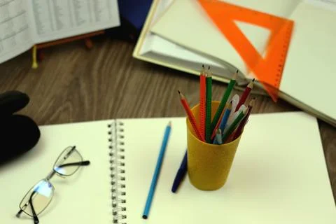 Study table with textbooks and pencils Stock Photos