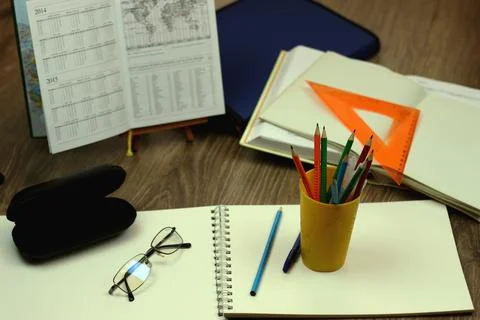 Study table with textbooks and pencils Stock Photos
