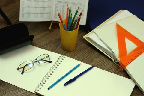 Study table with textbooks and pencils Stock Photos