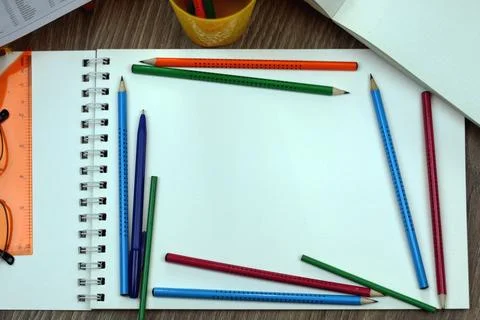 Study table with textbooks and pencils Stock Photos
