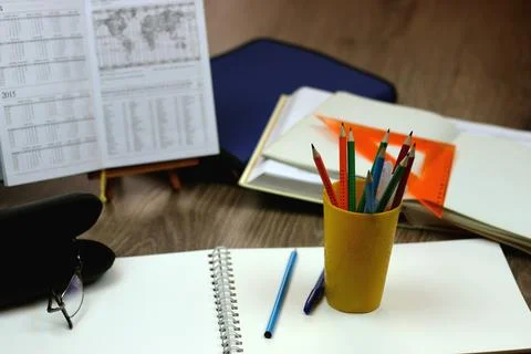 Study table with textbooks and pencils Stock Photos