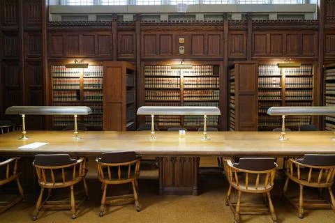 Study table in university library with law books Stock Photos