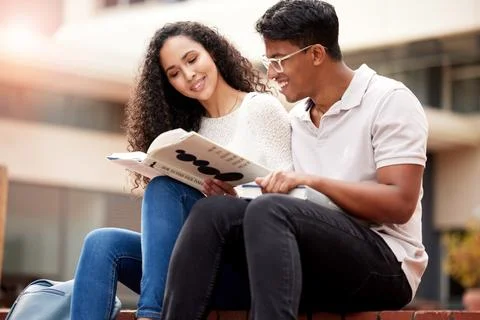Study, university and man and woman with book on campus for learning, knowledge Foto stock