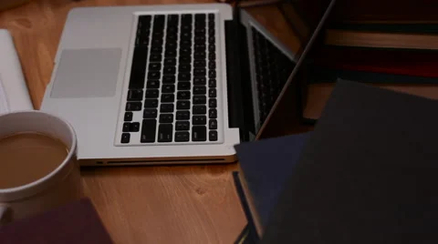 Study Workspace with Coffee, Laptop and Paper 스톡 동영상 46624804