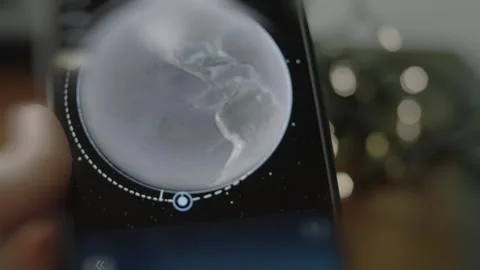 Studying about the Landsat 9 on smartphone, close up view Stock Footage 291459321
