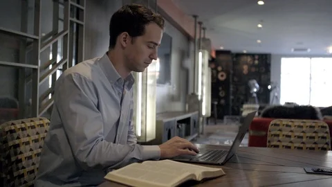 STUDYING THE BIBLE AT WORK Stock Footage 86086608