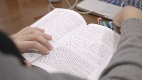 Studying Book and Using Highlighter Stock Footage 85000141