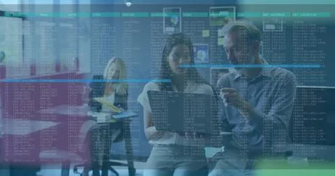 Studying code on digital screen at office, IT professionals wearing gray sweater Stock Photos