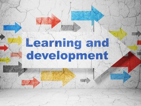 Studying concept: arrow with Learning And Development on grunge wall background Stockillustratie