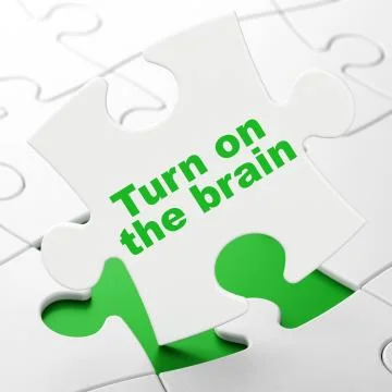 Studying concept: Turn On The Brain on puzzle background Illustrazione stock