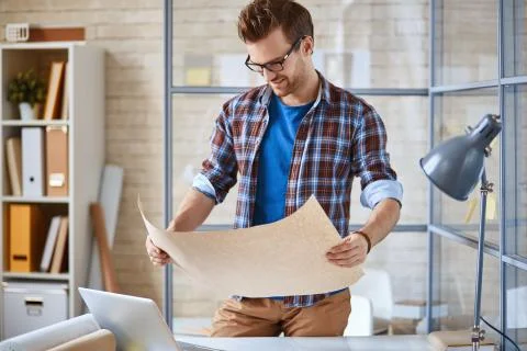 Studying document in office Stock Photos