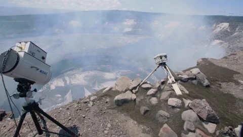 Studying volcano lake activity Stock Footage 248316148