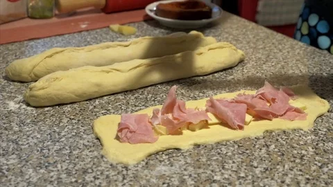 Stuff the bread with cheese, ham and salami Stock Footage 85314383