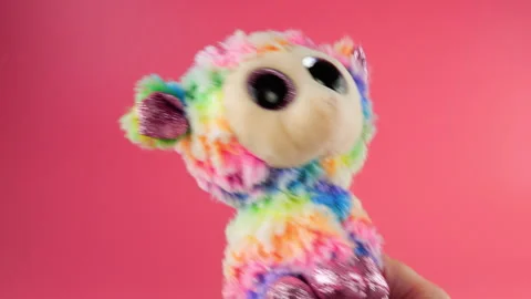 Stuffed and fluffy plush and rainbow toys sheep playing and dancing  Stock Footage 273484093