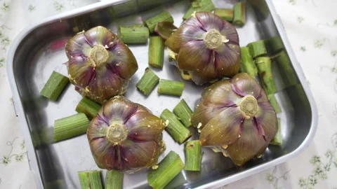 Stuffed artichokes in a tray Stock Footage 267841370