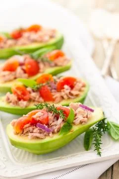 Stuffed avocado on tray. Stock Photos