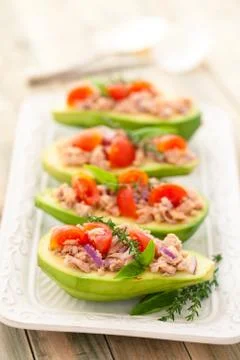 Stuffed avocado on tray. Stock Photos