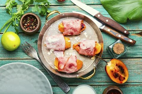 Stuffed bacon with tamarillo Stock Photos
