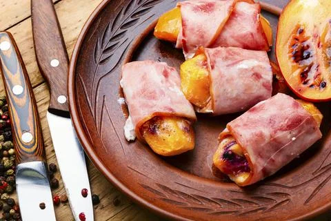 Stuffed bacon with tamarillo Stock Photos