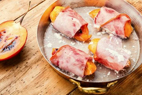 Stuffed bacon with tamarillo Stock Photos
