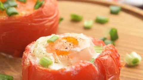 Stuffed baked tomatoes with eggs and green onion Video stock 73072193