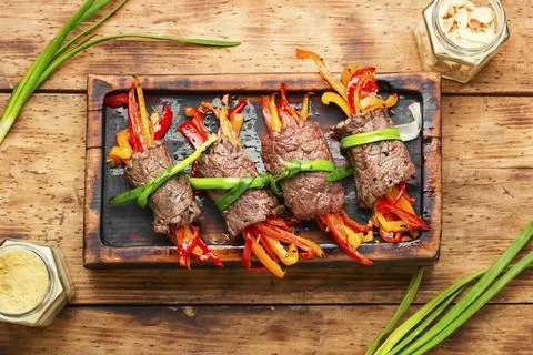 Stuffed beef rolls on cutting board Stock Photos