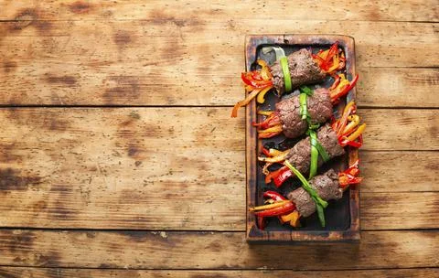 Stuffed beef rolls on cutting board Stock Photos