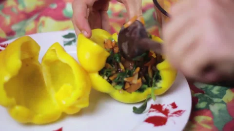 Stuffed bell peppers being prepared Stock Footage 35222381