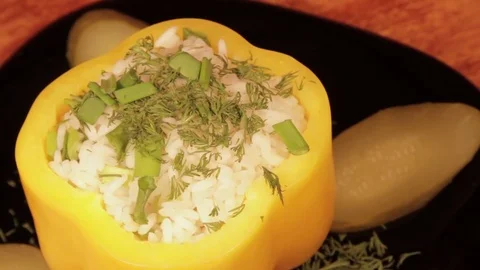 Stuffed bell peppers filled with rice on the wooden background Stock Footage 71734571