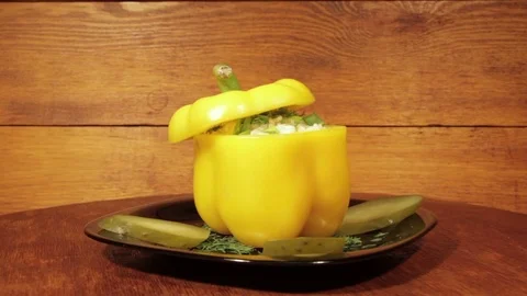 Stuffed bell peppers filled with rice on the wooden background Stock Footage 71734845