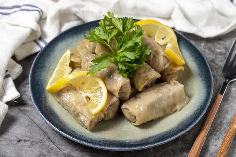 Stuffed cabbage on dark background. Turkish cuisine appetizer flavors. close  Stock Photos