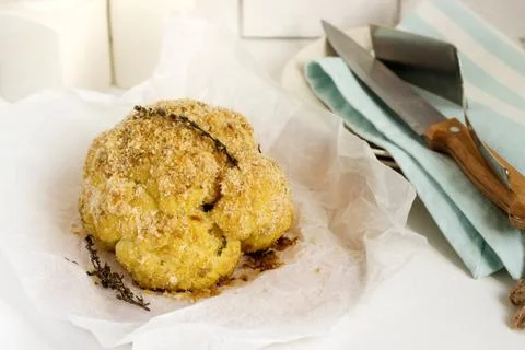 Stuffed cauliflower with chard and bread crumbs. Rustic style. Stock Photos