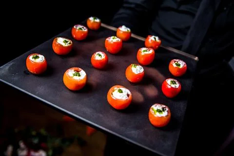 Stuffed cherry tomatoes on a buffet table. Stock Photos