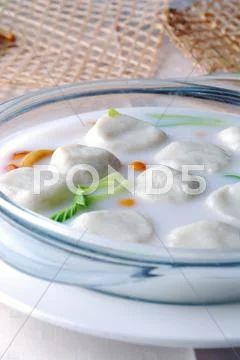 Stuffed dumplings made glutinous rice flour served in soup Stock Photos