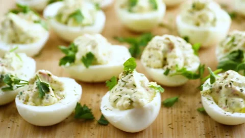Stuffed eggs, deviled eggs on a wooden table Stock Footage 273509465