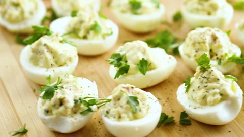 Stuffed eggs, deviled eggs on a wooden table Stock Footage 274573597